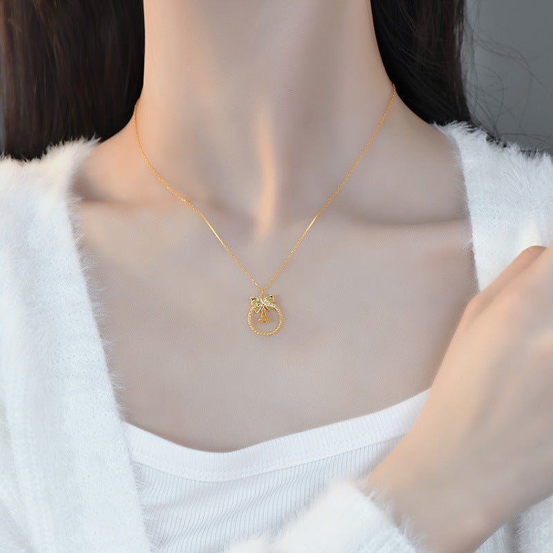 Bow and Bell Necklace
